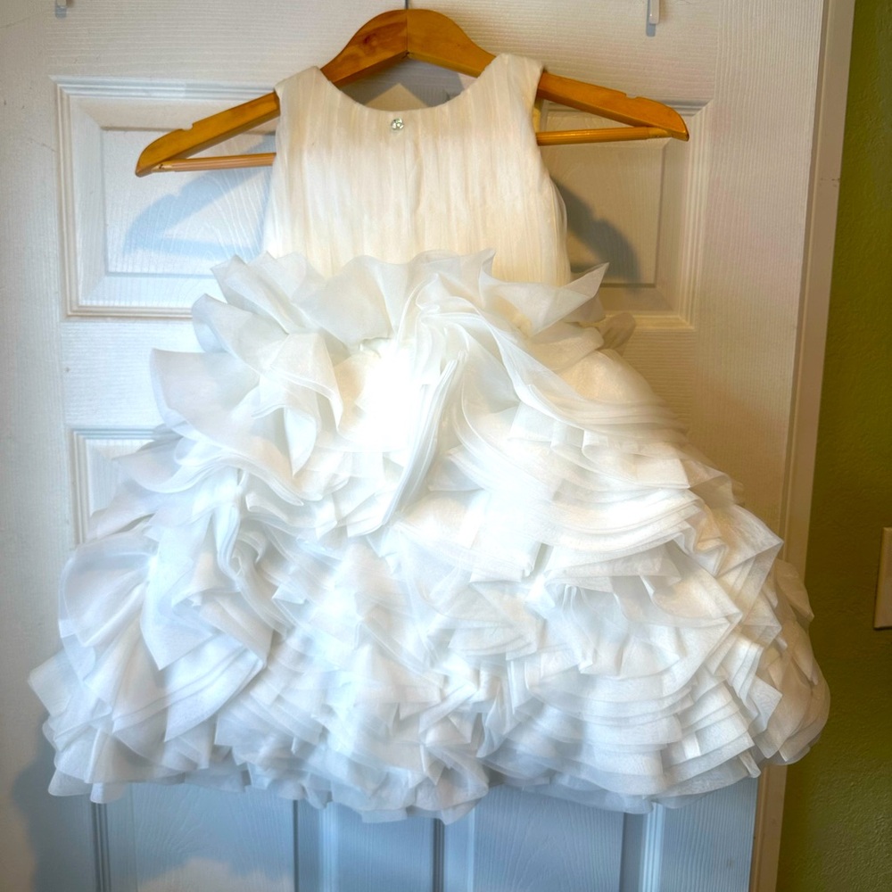 Beautiful girls white sleeveless dress.